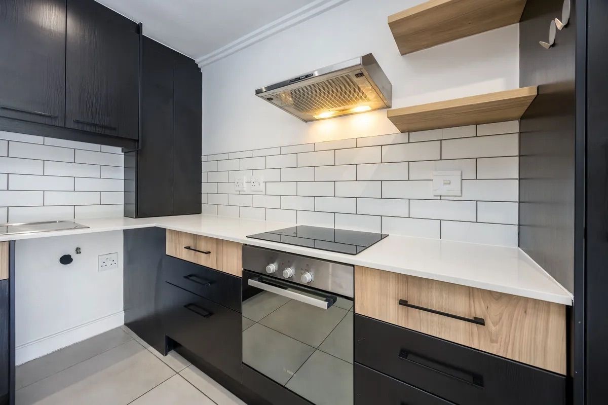 Freshly cleaned modern kitchen with spotless worktops and appliances