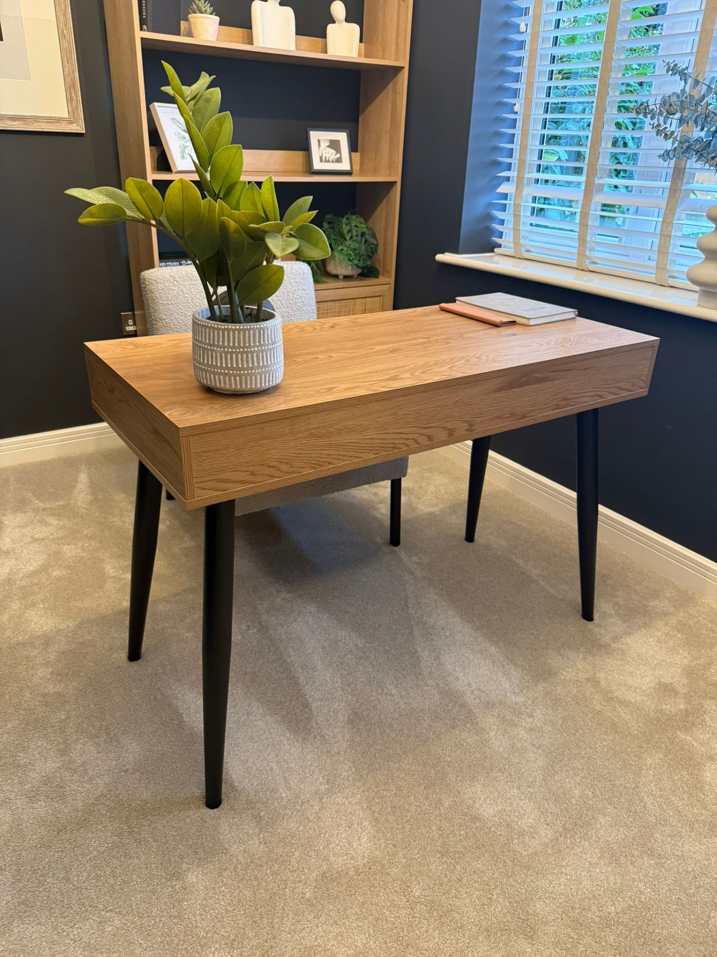 Freshly cleaned home office with a tidy desk and immaculate carpet